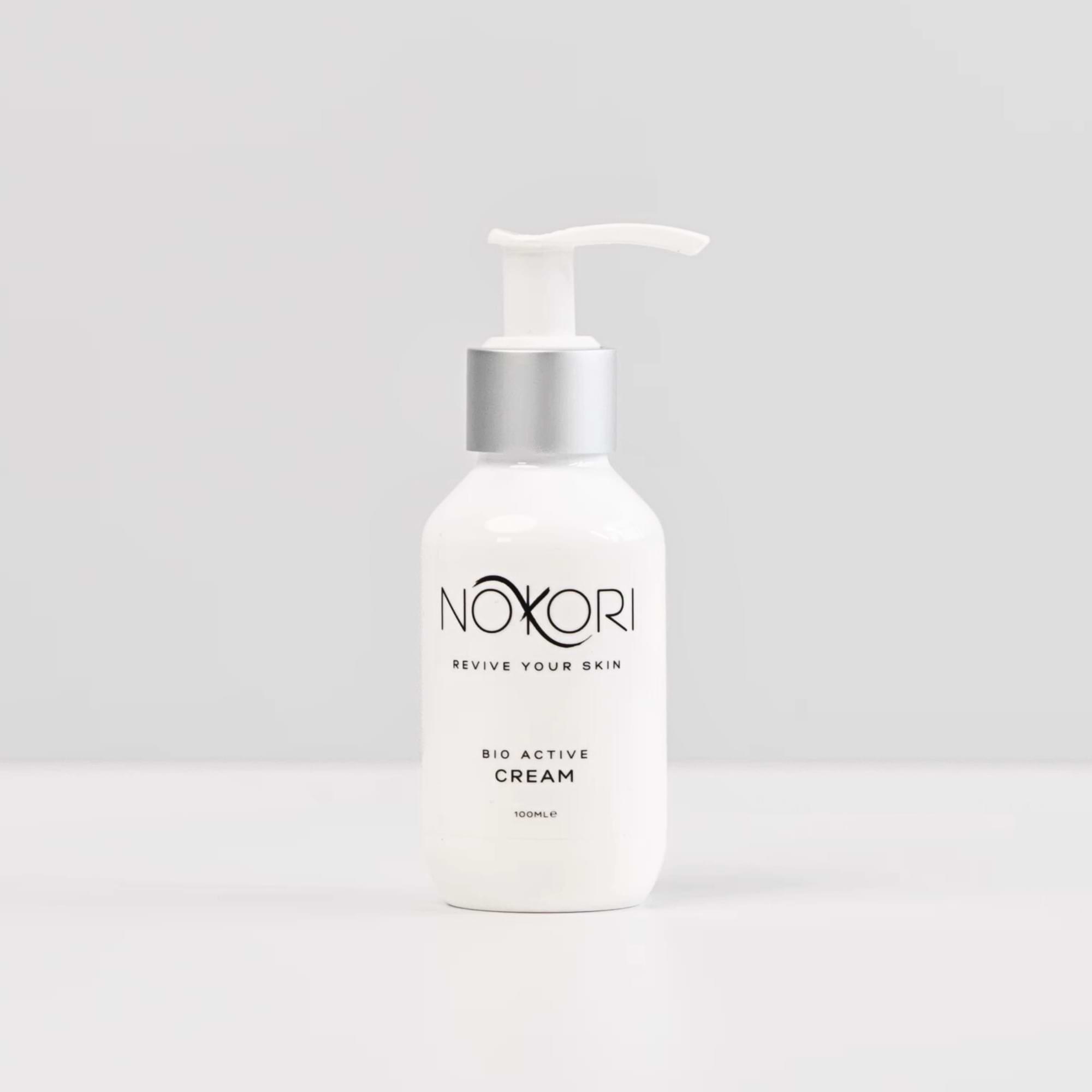 Bio Active Cream from the Nokori Pre & Post Procedure Kit standing upright on a white surface against a neutral background.